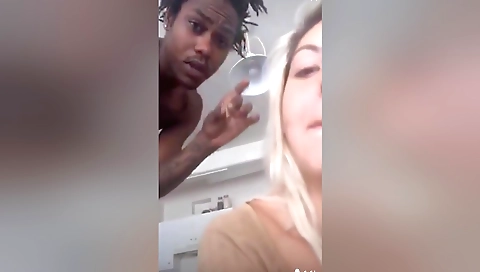 Blonde in tight shorts does interracial porn on camera