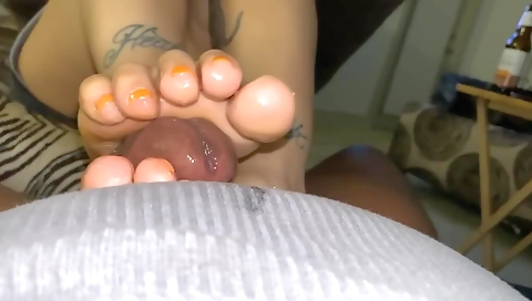 Amateur interracial footjob in pov with the tattooed chick