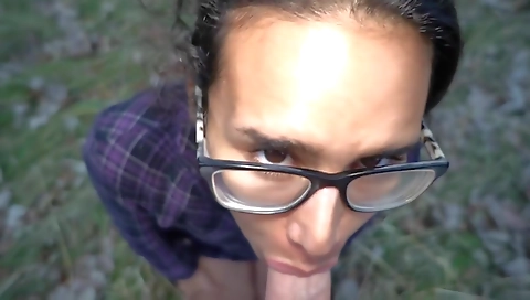 Brunette teen caught with a dick in her mouth on the park