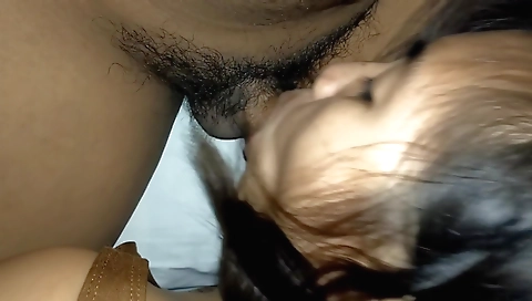 Asian teen with a hairy pussy gives a handjob to a dude