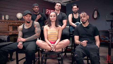 Brunette girl in a black blazer and black stockings