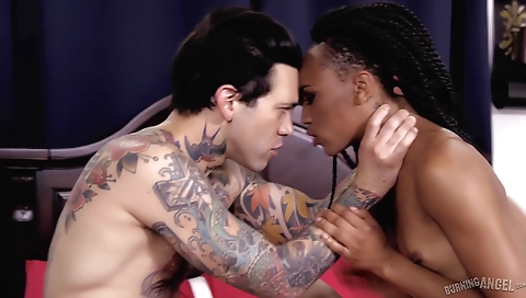 Amateur interracial threesome with a tattooed guy and a blonde girl